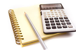 image of calculator, notepad and pen